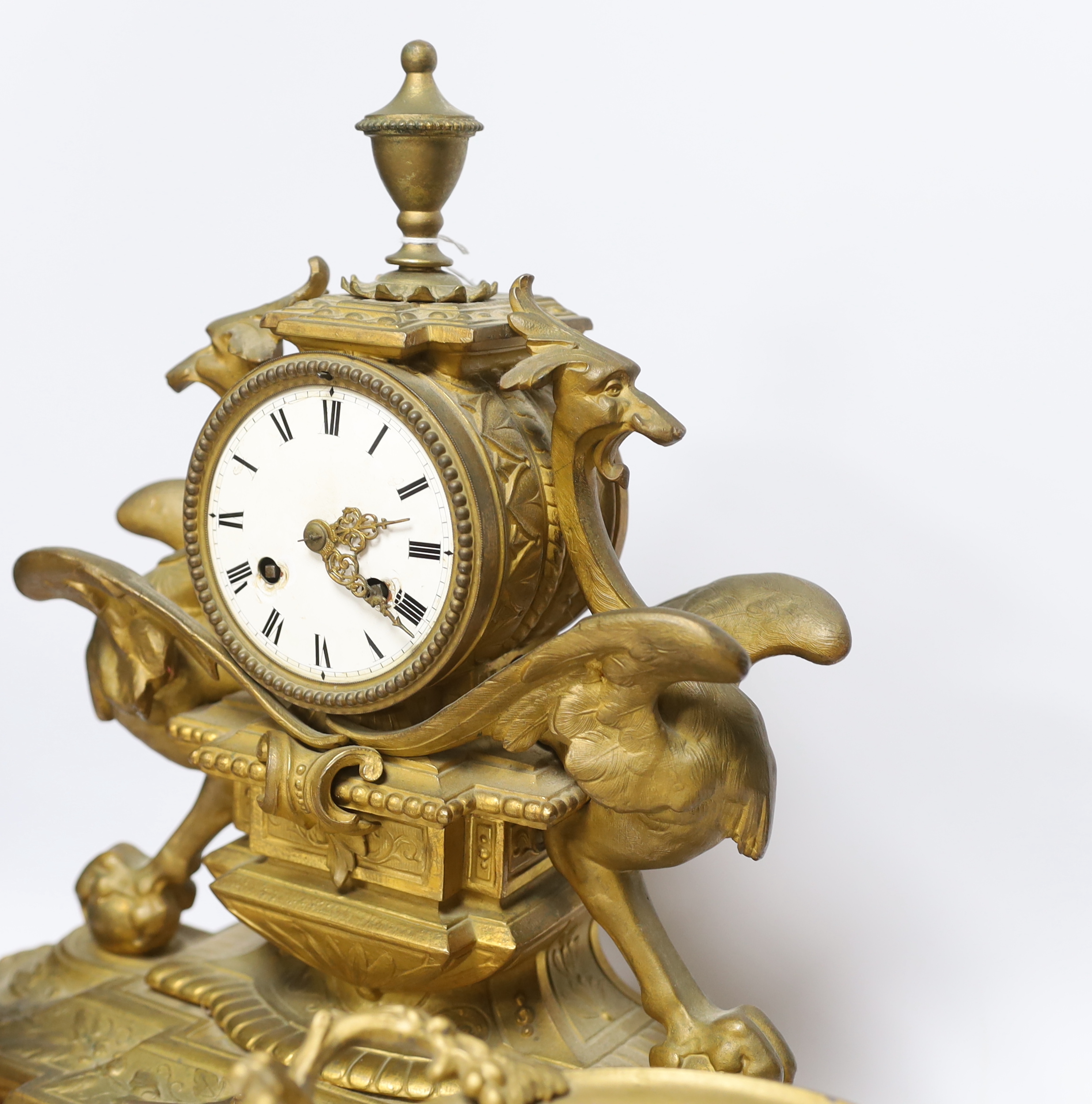 A Victorian gilt painted spelter mantel clock garniture, (dome missing) clock 43cm high